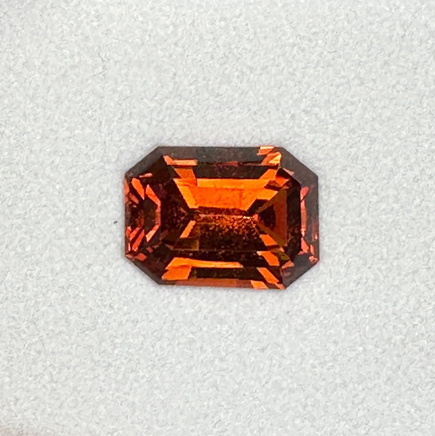 7.22ct Emerald Cut Deep Orange Malaya Garnet