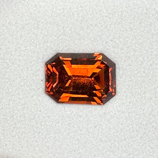 7.22ct Emerald Cut Deep Orange Malaya Garnet